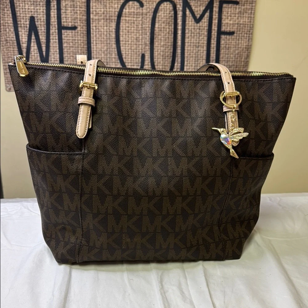 Michael Kors Jet‎ Set Travel Tote w/ Hummingbird Charm – Brown MK Monogram